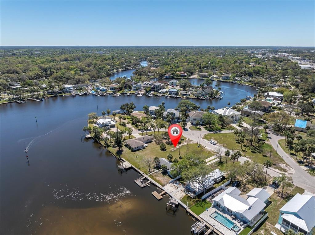 5433 Cotee River Drive New Port Richey, FL 34652 - Photo 14 of 18 an aerial view of a house with a lake view