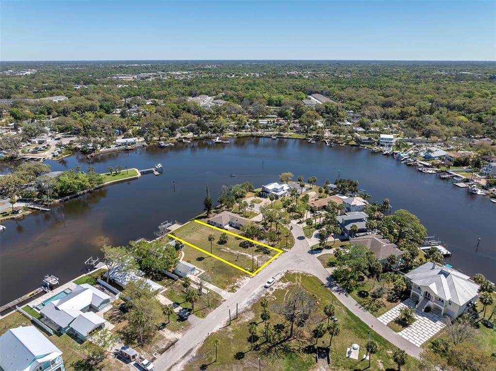 5433 Cotee River Drive New Port Richey, FL 34652 - Photo 17 of 18 an aerial view of a house with a lake view