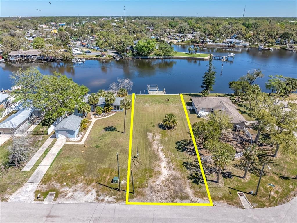 5433 Cotee River Drive New Port Richey, FL 34652 - Photo 4 of 18 an aerial view of house with yard swimming pool and ocean view