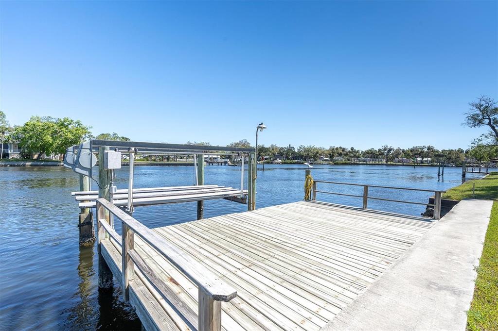 5433 Cotee River Drive New Port Richey, FL 34652 - Photo 8 of 18 a view of a swimming pool with a terrace