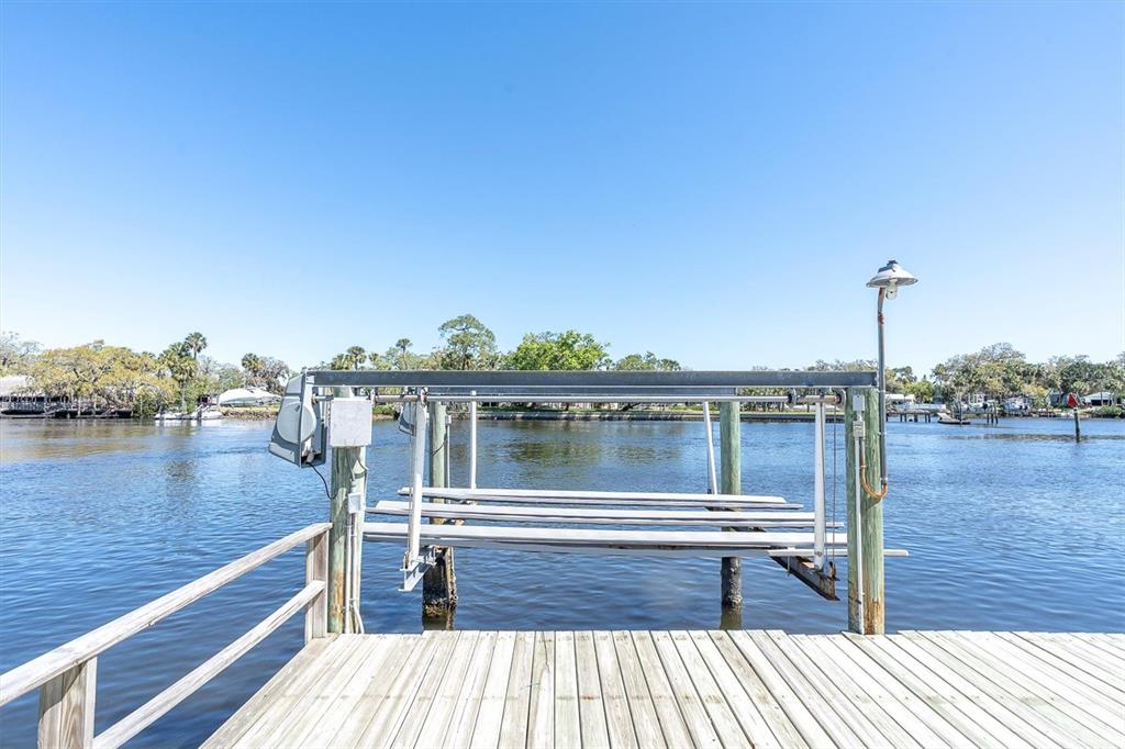 5433 Cotee River Drive New Port Richey, FL 34652 - Photo 9 of 18 a view of a lake from a balcony