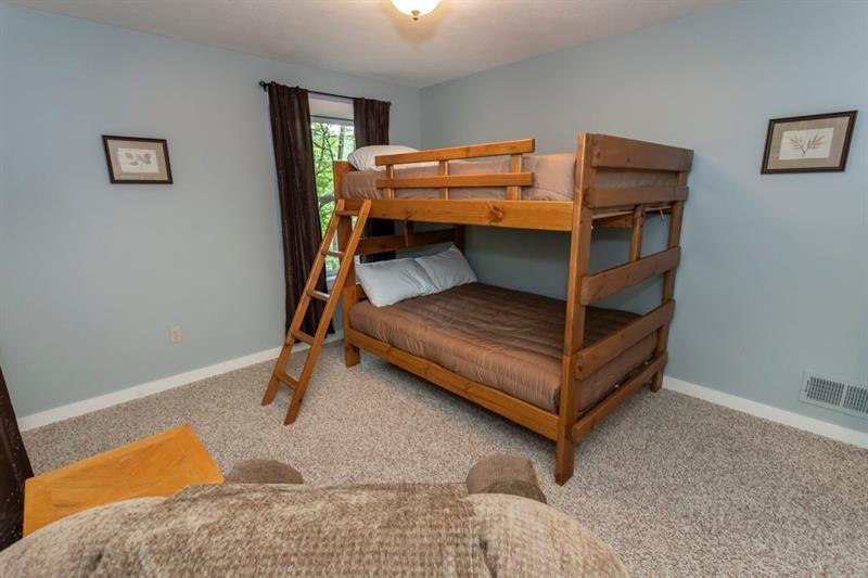 2226 County Line Road Champion, PA 15622 - Photo 26 of 33 a bed sitting in a bedroom next to a window