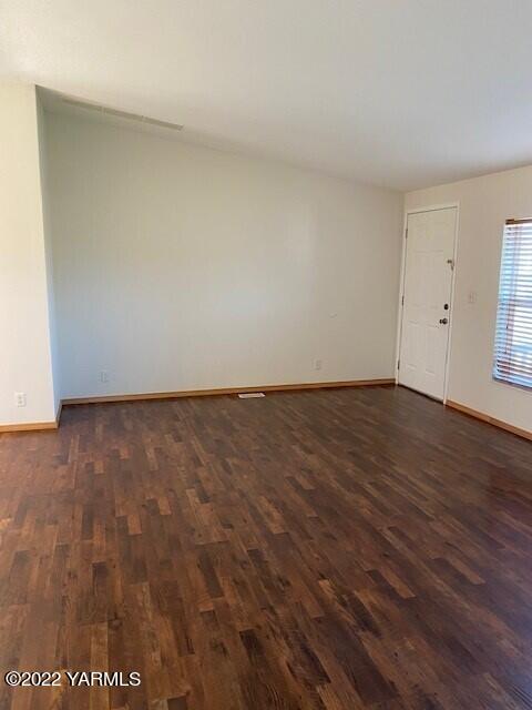 15472 Summitview Road Cowiche, WA 98923 - Photo 12 of 15 a view of an empty room with wooden floor