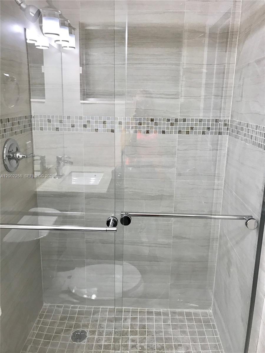 3700 Taft Street Hollywood, FL 33021 - Photo 2 of 10 a bathroom with a shower