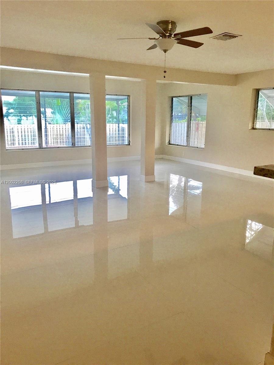 3700 Taft Street Hollywood, FL 33021 - Photo 9 of 10 a view of an empty room with windows