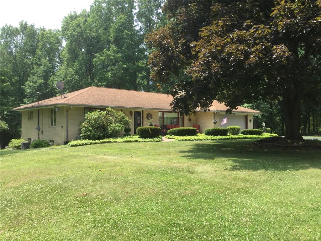 SOLID-BUILT, BRICK RANCH-STYLE HOME ON A PICTURESQUE LOT!