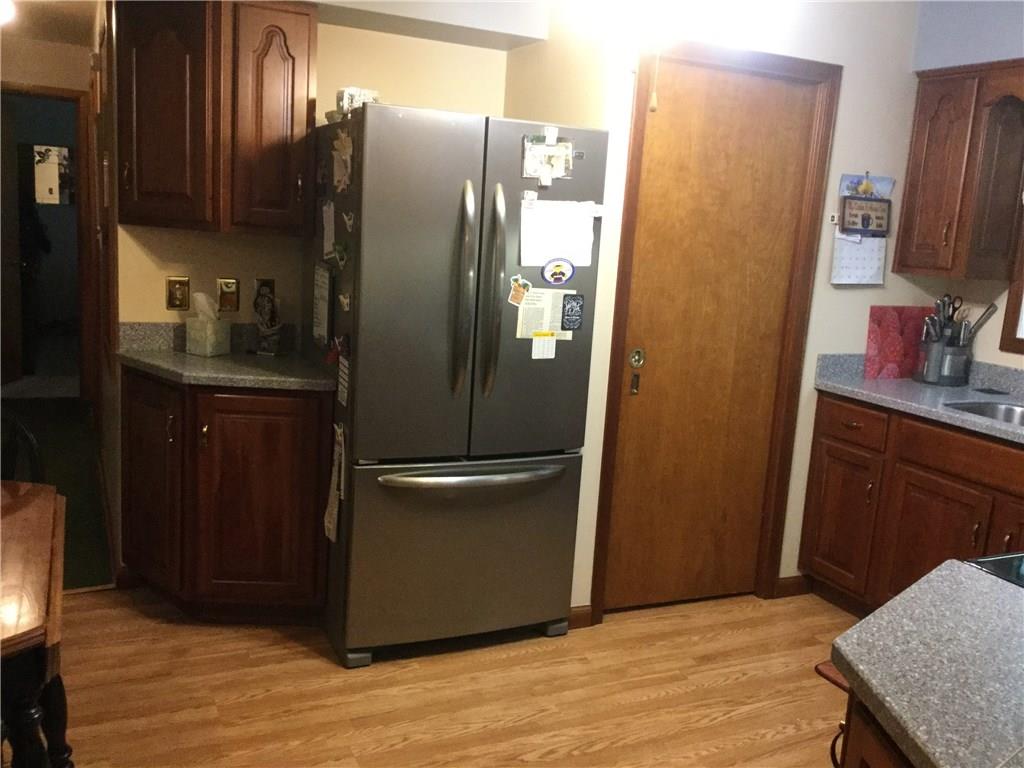 THERE'S A PANTRY BEHIND THE POCKET DOOR ON THE WAY TO THE BASEMENT.  THE REFRIGERATOR IS INCLUDED.