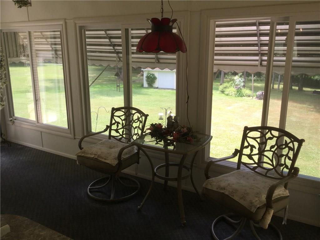 296 South Keel Ridge Road Hermitage, PA 16148 - Photo 9 of 25 SUNROOM WITH AWNINGS THAT ARE INCLUDED IN THE SALE.