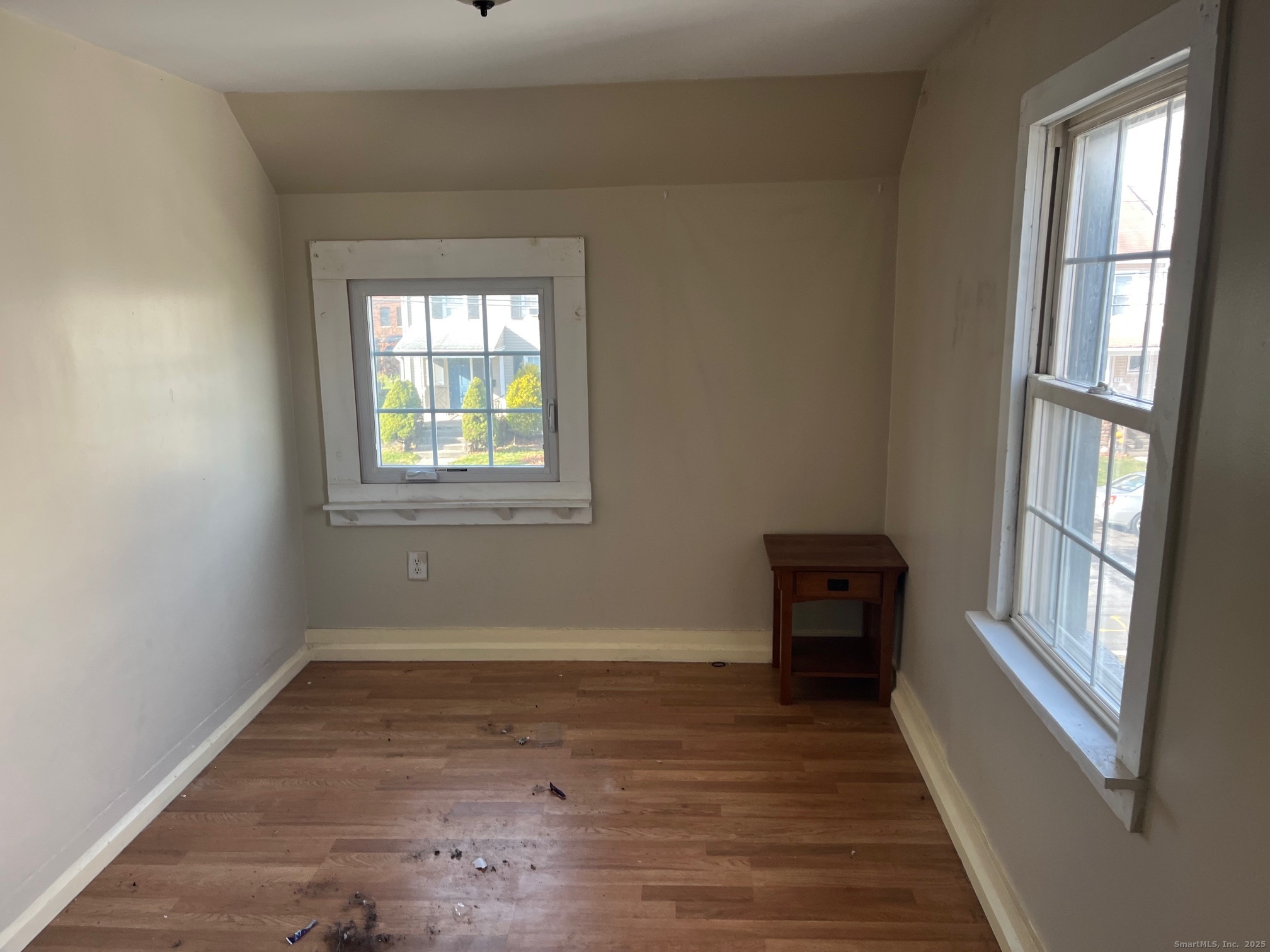 43 North Pearl Street Meriden, CT 06450 - Photo 15 of 20 an empty room with wooden floor and windows