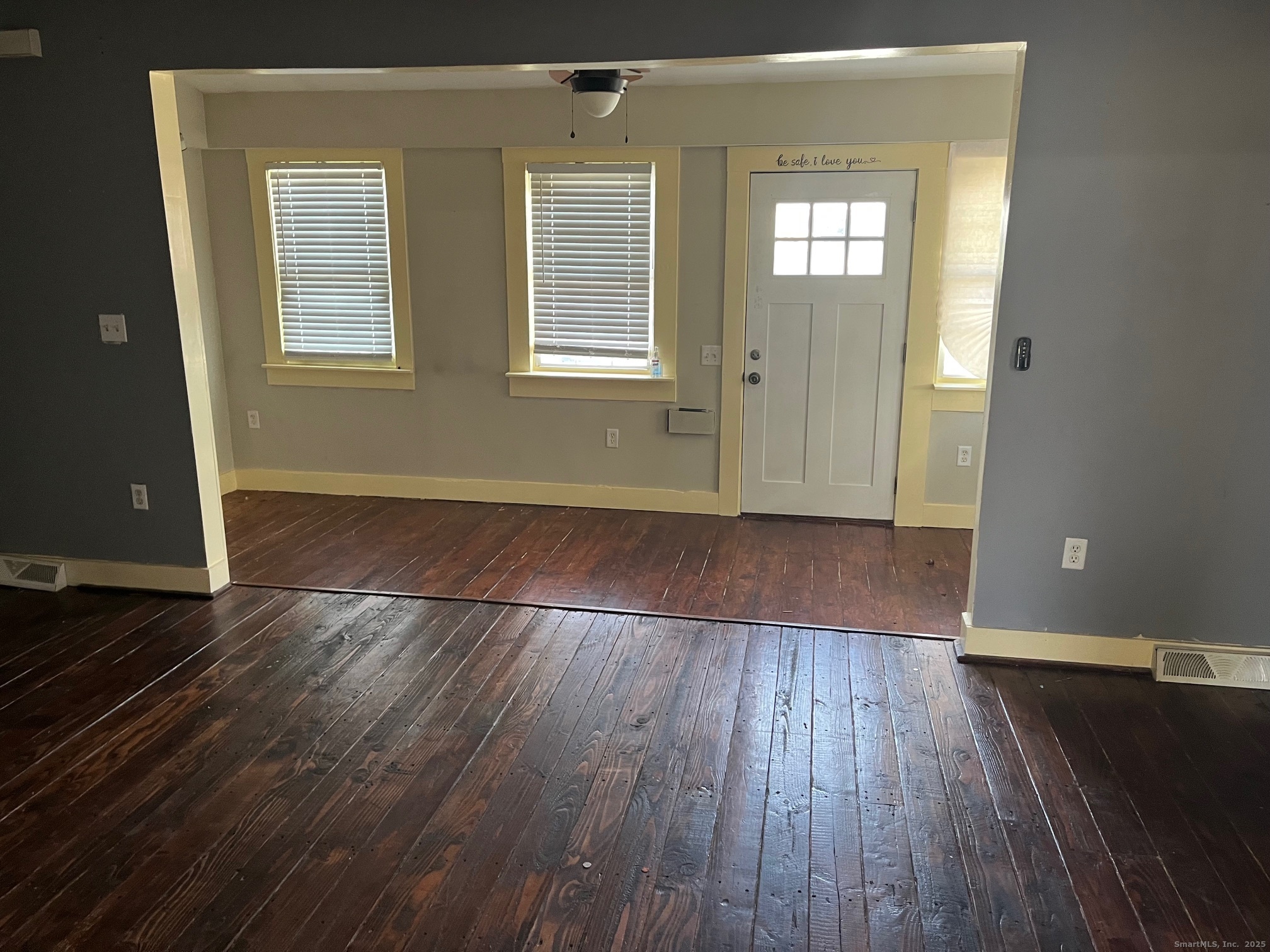 43 North Pearl Street Meriden, CT 06450 - Photo 10 of 20 an empty room with wooden floor and windows