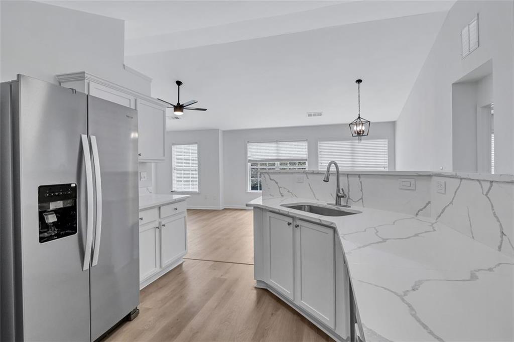 2540 Willow Grove Road, Unit 15 Acworth, GA 30101 - Photo 11 of 35 a kitchen with stainless steel appliances granite countertop a refrigerator and a sink
