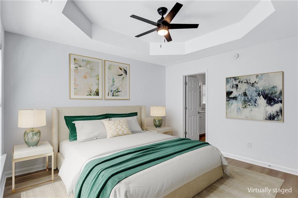 2540 Willow Grove Road, Unit 15 Acworth, GA 30101 - Photo 19 of 35 a bedroom with a large bed and a painting on the wall