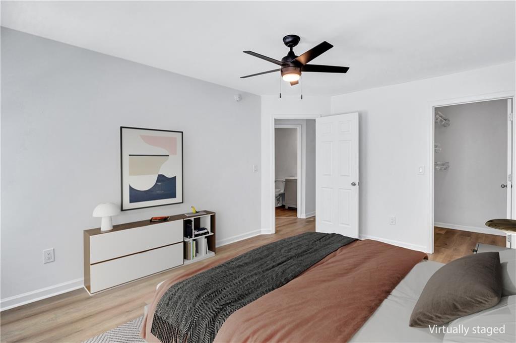 2540 Willow Grove Road, Unit 15 Acworth, GA 30101 - Photo 24 of 35 a bedroom with a bed and a painting on the wall