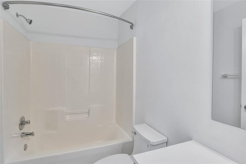 2540 Willow Grove Road, Unit 15 Acworth, GA 30101 - Photo 27 of 35 a bathroom with a toilet and a bathtub