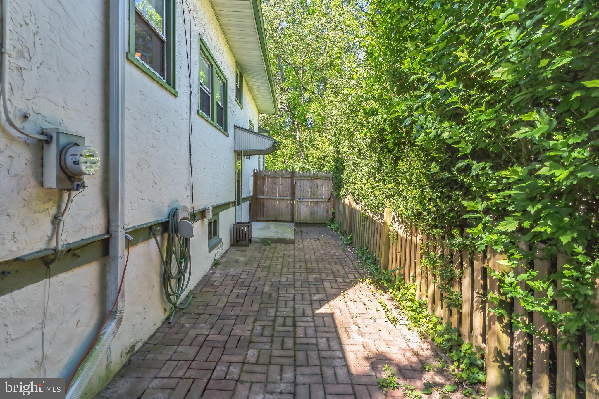 25 Ridley Avenue Aldan, PA 19018 - Photo 32 of 37 Brick patio on side of house.
