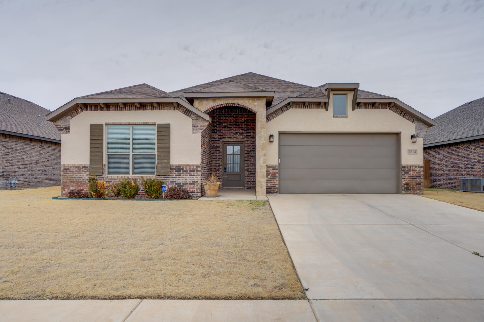 a front view of a house with yard