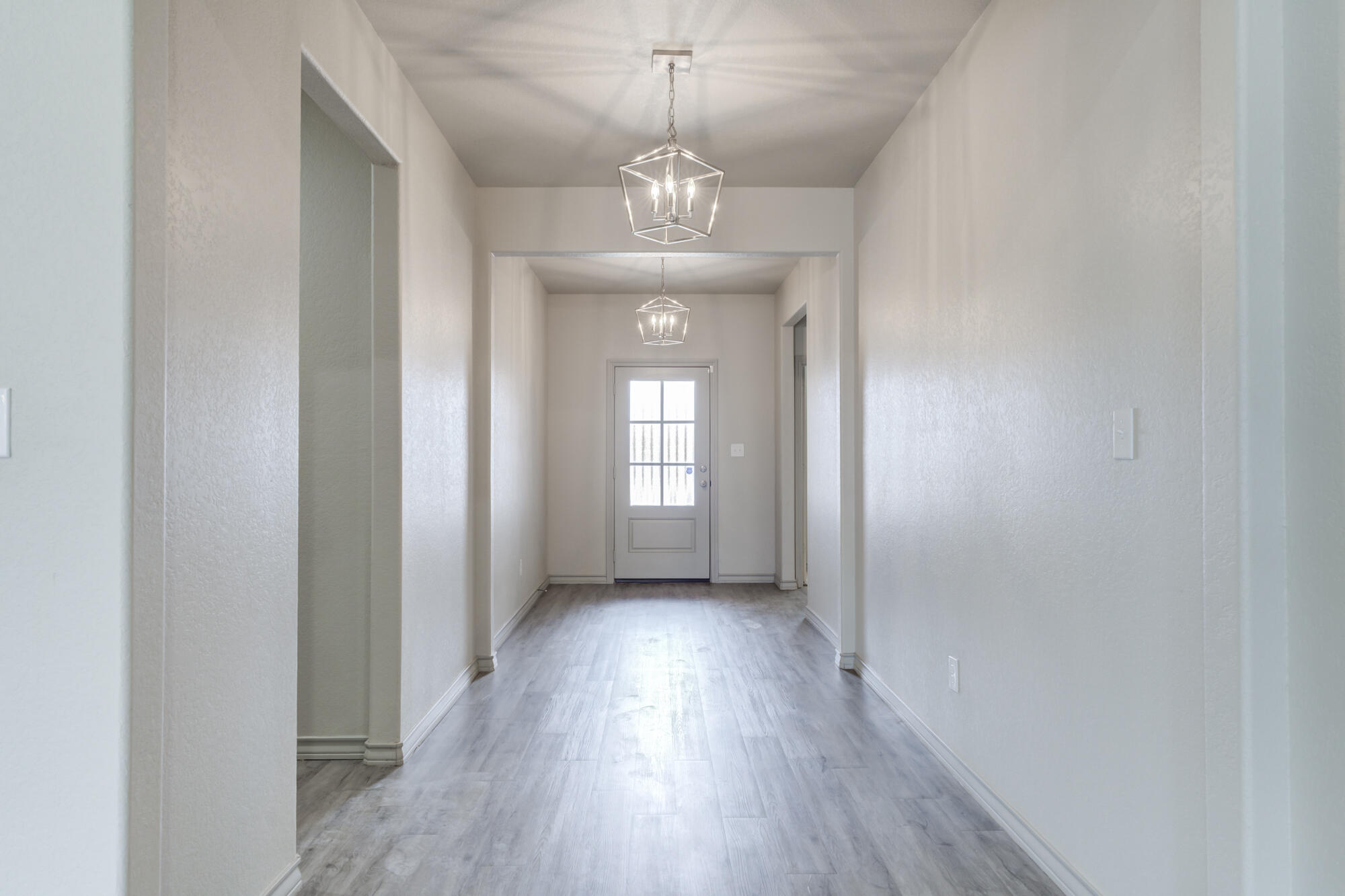 7614 62nd Street Lubbock, TX 79407 - Photo 17 of 54 a view of a room with wooden floor and windows