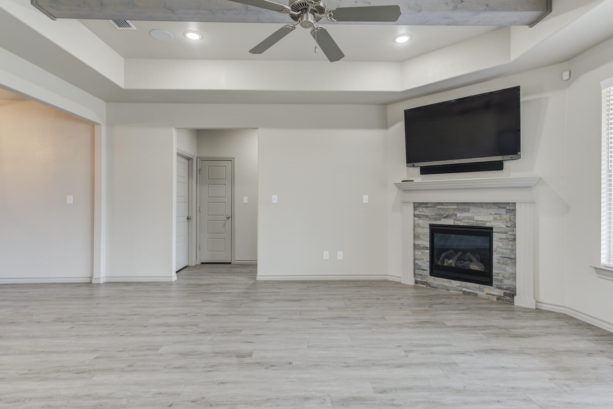 7614 62nd Street Lubbock, TX 79407 - Photo 21 of 54 a living room with furniture fireplace and flat screen tv