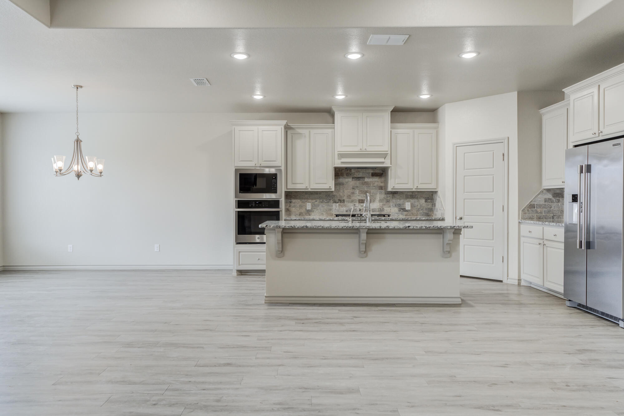 7614 62nd Street Lubbock, TX 79407 - Photo 24 of 54 a view of kitchen with stainless steel appliances granite countertop cabinets and a counter top space
