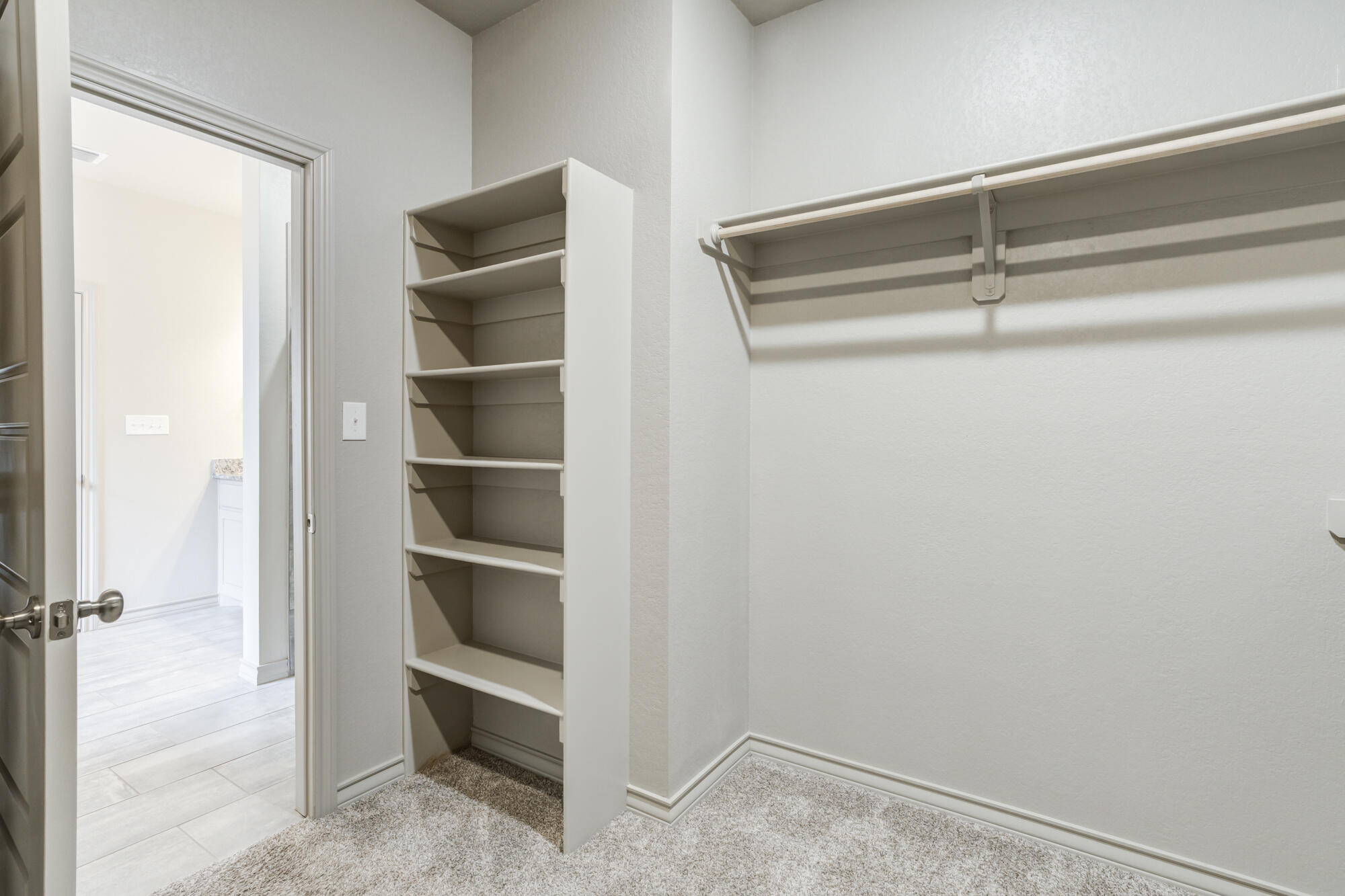 7614 62nd Street Lubbock, TX 79407 - Photo 40 of 54 a view of an empty walk in closet