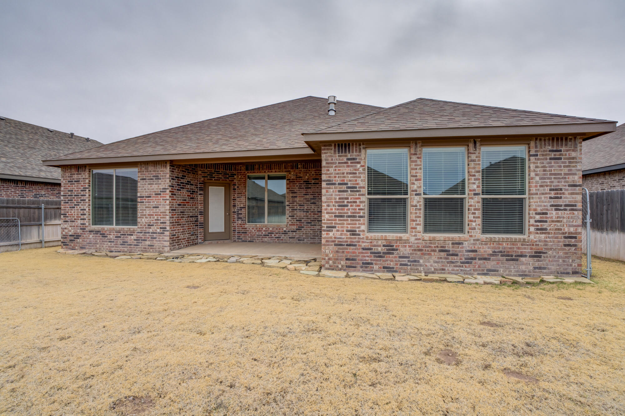 7614 62nd Street Lubbock, TX 79407 - Photo 53 of 54 a front view of a house with a yard