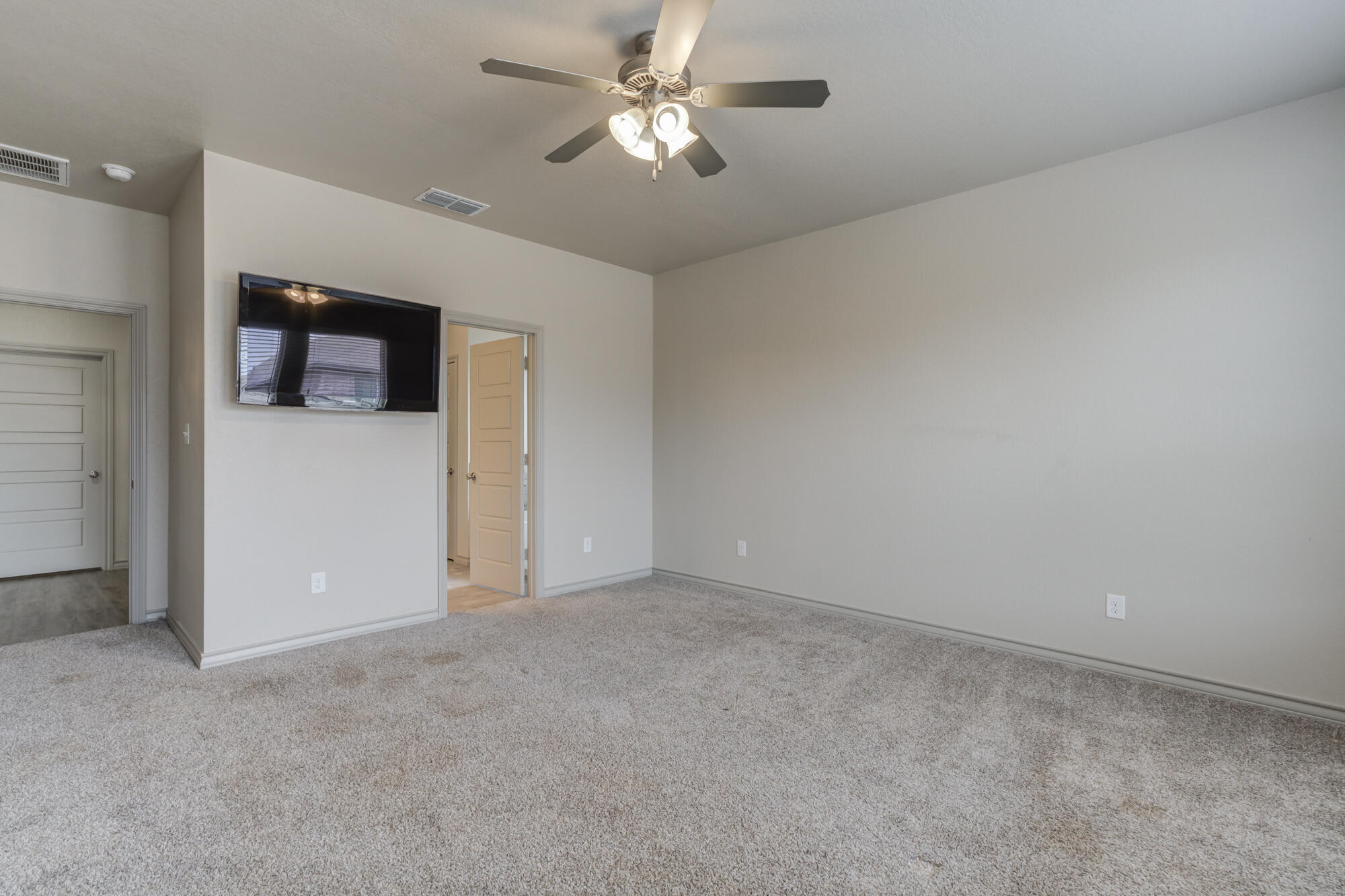7614 62nd Street Lubbock, TX 79407 - Photo 7 of 54 a view of a big room with carpet