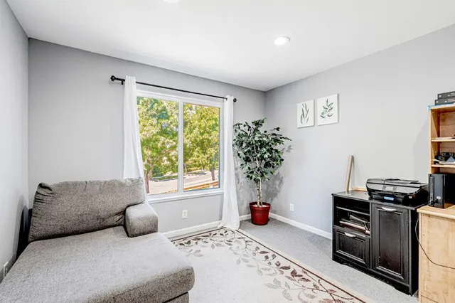 a bedroom with furniture and a window