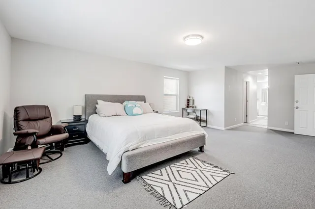 a bedroom with a bed and furniture