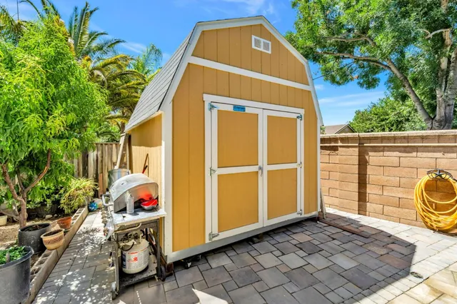 a view of a wooden door and a yard