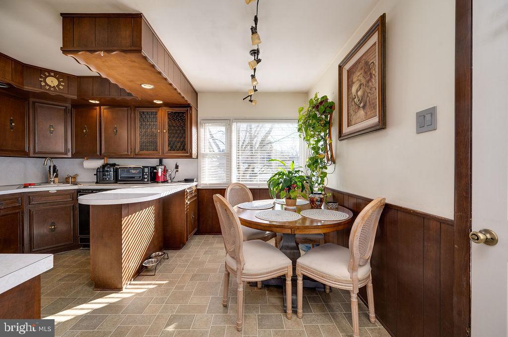 504 Harding Avenue Reading, PA 19607 - Photo 14 of 45 a kitchen with a table chairs sink and cabinets
