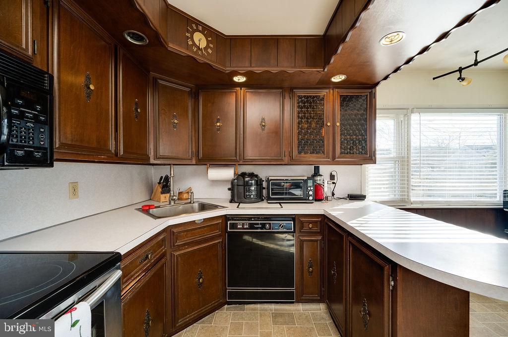 504 Harding Avenue Reading, PA 19607 - Photo 18 of 45 a kitchen with stainless steel appliances granite countertop a sink stove and cabinets