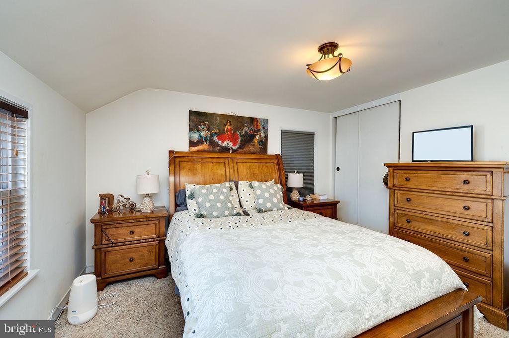 504 Harding Avenue Reading, PA 19607 - Photo 23 of 45 a bedroom with a bed and a chandelier