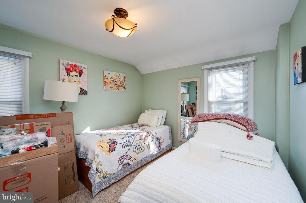 504 Harding Avenue Reading, PA 19607 - Photo 28 of 45 a bedroom with a bed and a chandelier