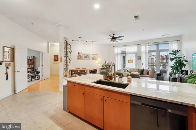 a kitchen with sink a counter and cabinets