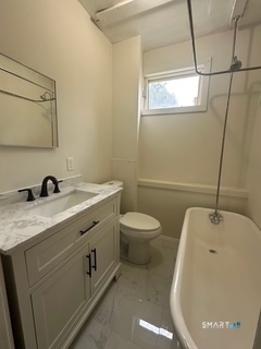 44 Prest Street, Unit 1 New London, CT 06320 - Photo 4 of 9 a bathroom with a granite countertop sink toilet and shower