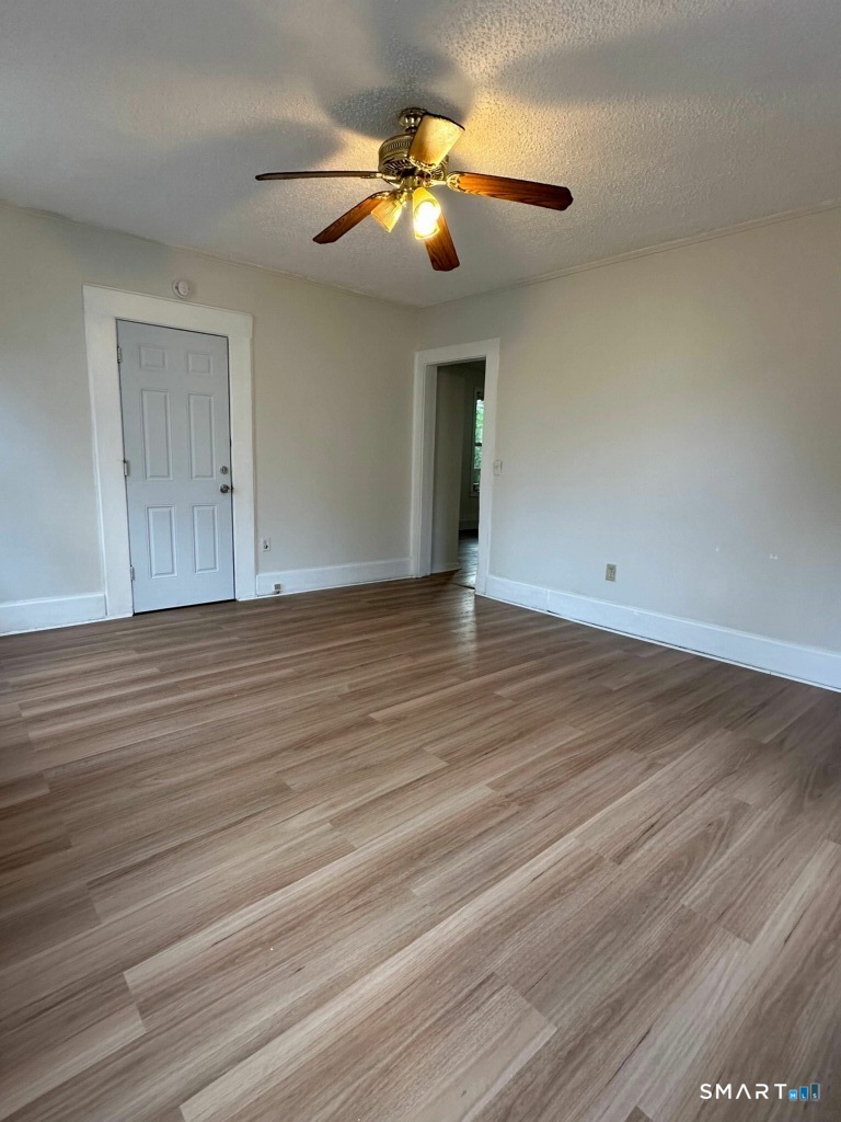 44 Prest Street, Unit 1 New London, CT 06320 - Photo 8 of 9 wooden floor in an empty room