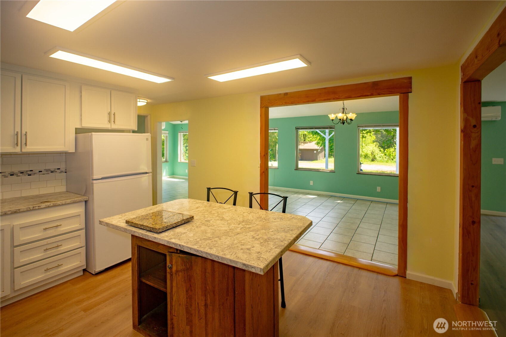89 Slab Camp Road Sequim, WA 98382 - Photo 12 of 40 a kitchen with a refrigerator and countertop
