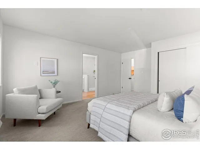 a bedroom with a bed and a couch