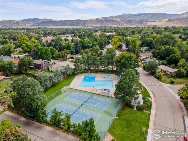 a view of a swimming pool with a yard