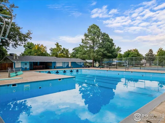 a view of a street with an outdoor seating