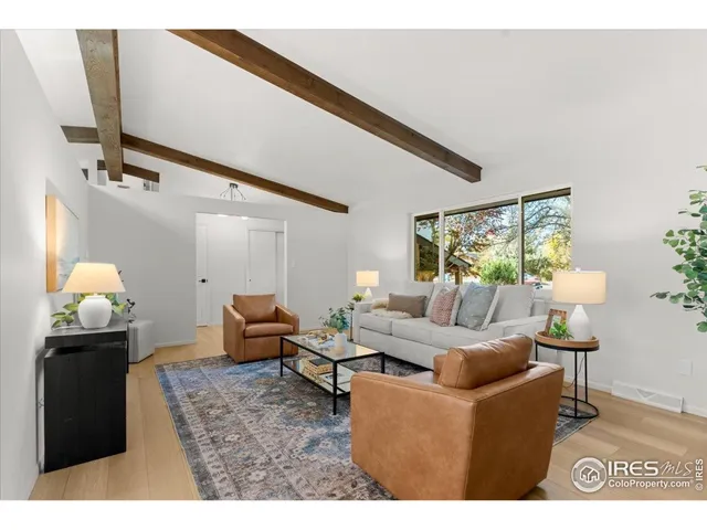 a living room with furniture and lamp