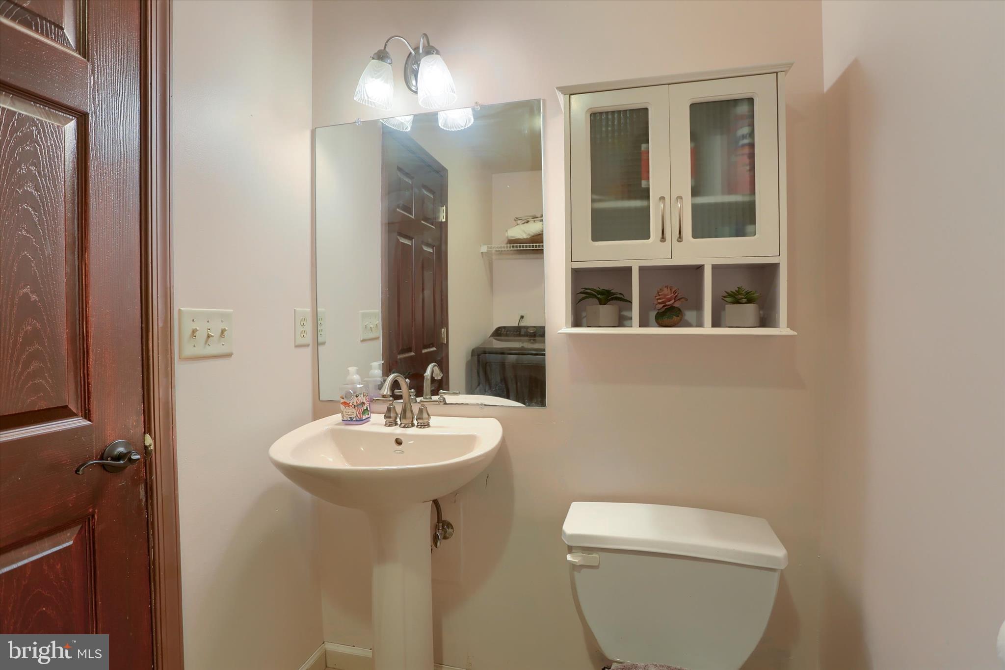 12 Edgewater Drive Middletown, PA 17057 - Photo 16 of 39 a bathroom with a toilet sink and mirror