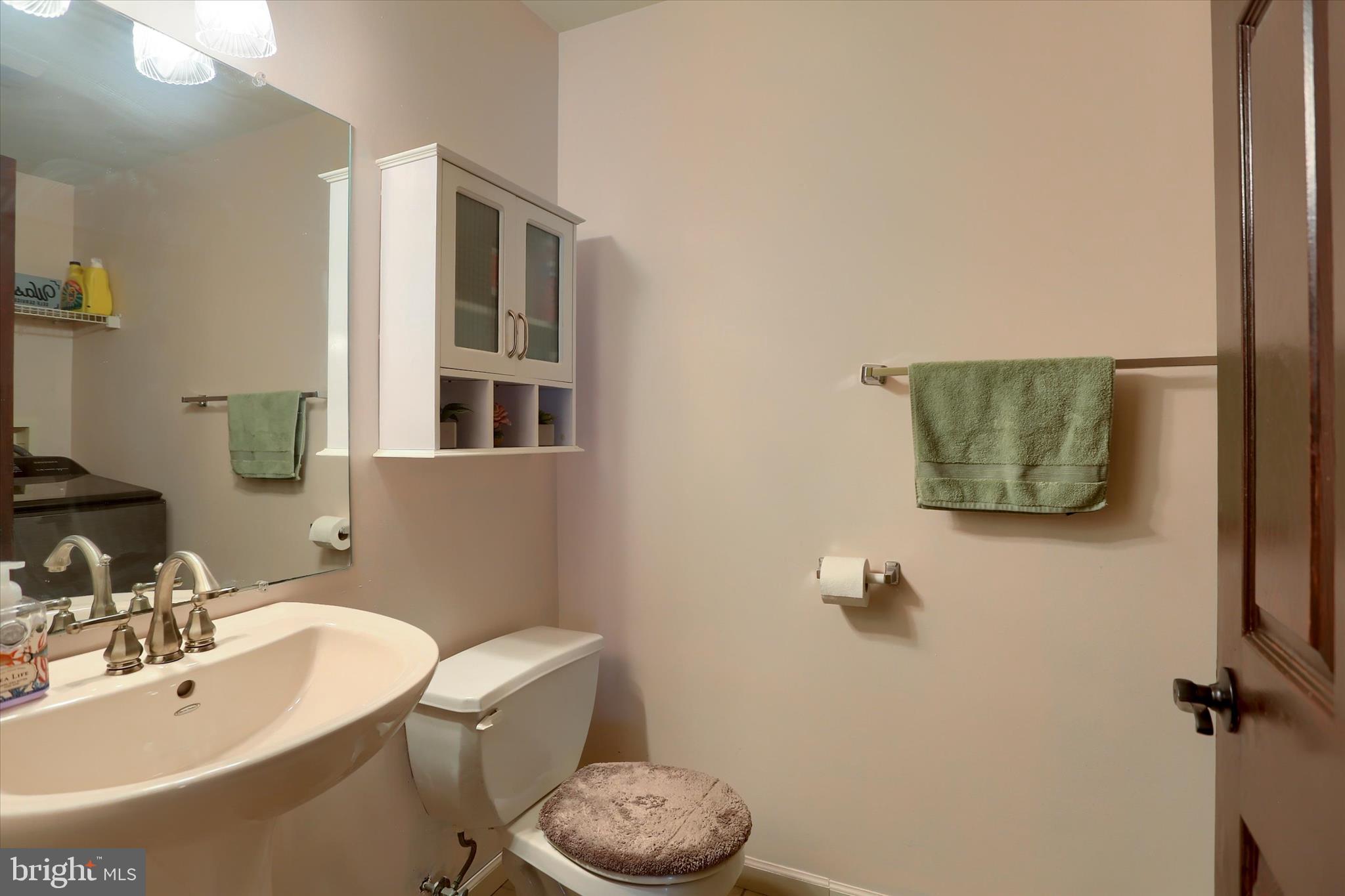 12 Edgewater Drive Middletown, PA 17057 - Photo 17 of 39 a bathroom with a sink mirror vanity and toilet