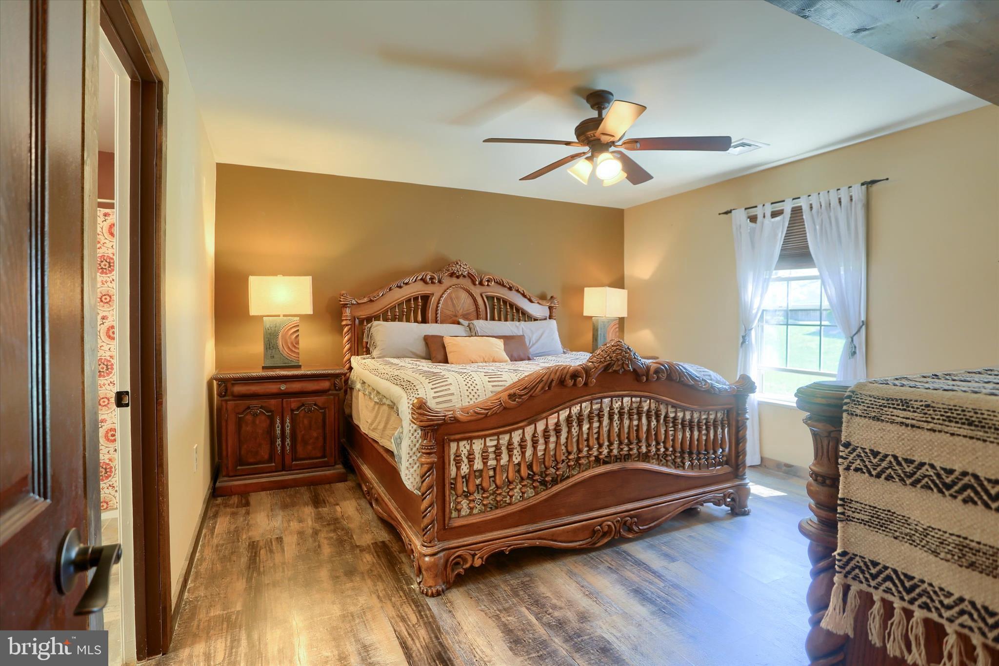 12 Edgewater Drive Middletown, PA 17057 - Photo 19 of 39 a bedroom with a bed and wooden floor