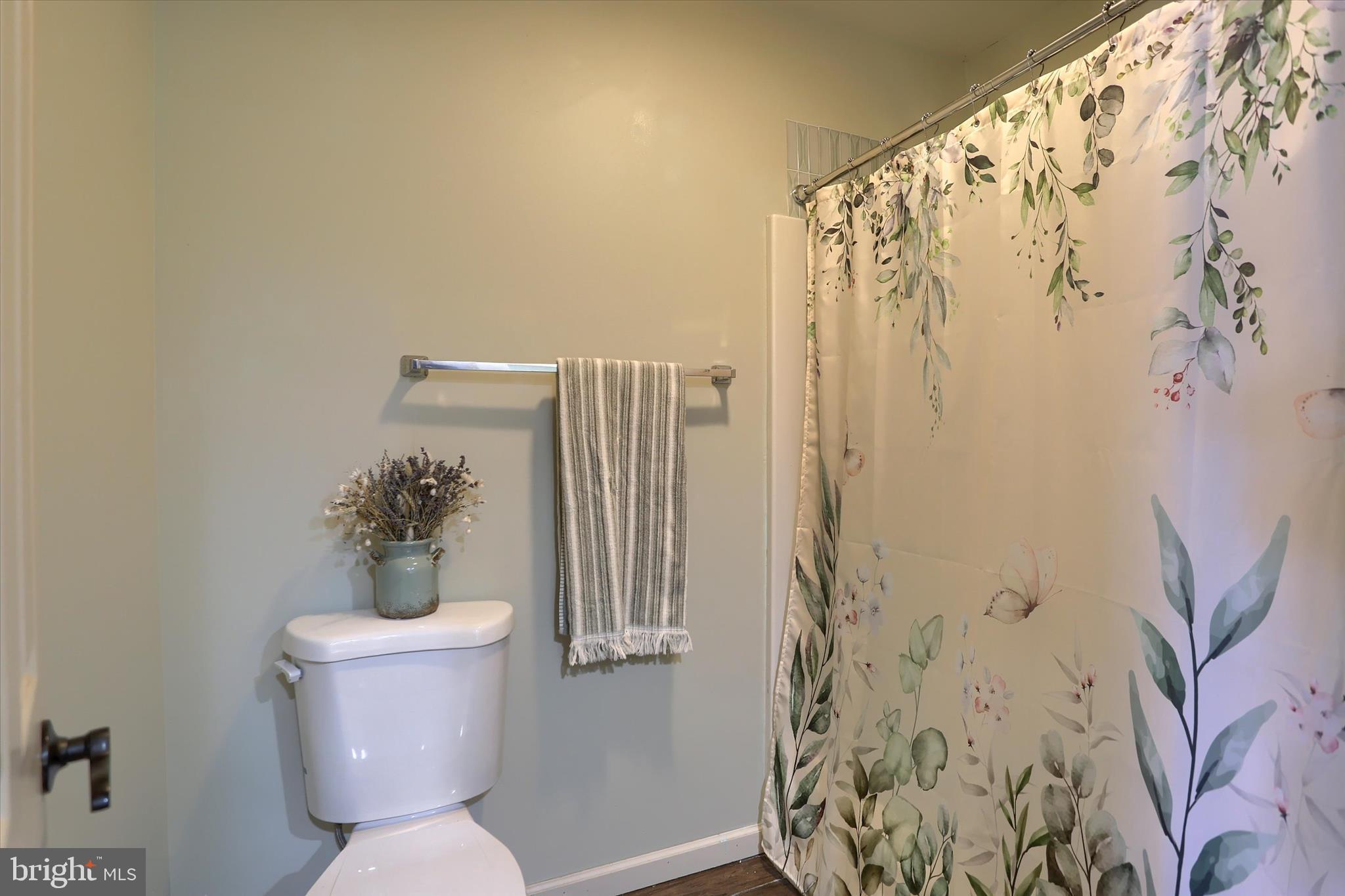 12 Edgewater Drive Middletown, PA 17057 - Photo 29 of 39 a white toilet sitting next to a shower curtain