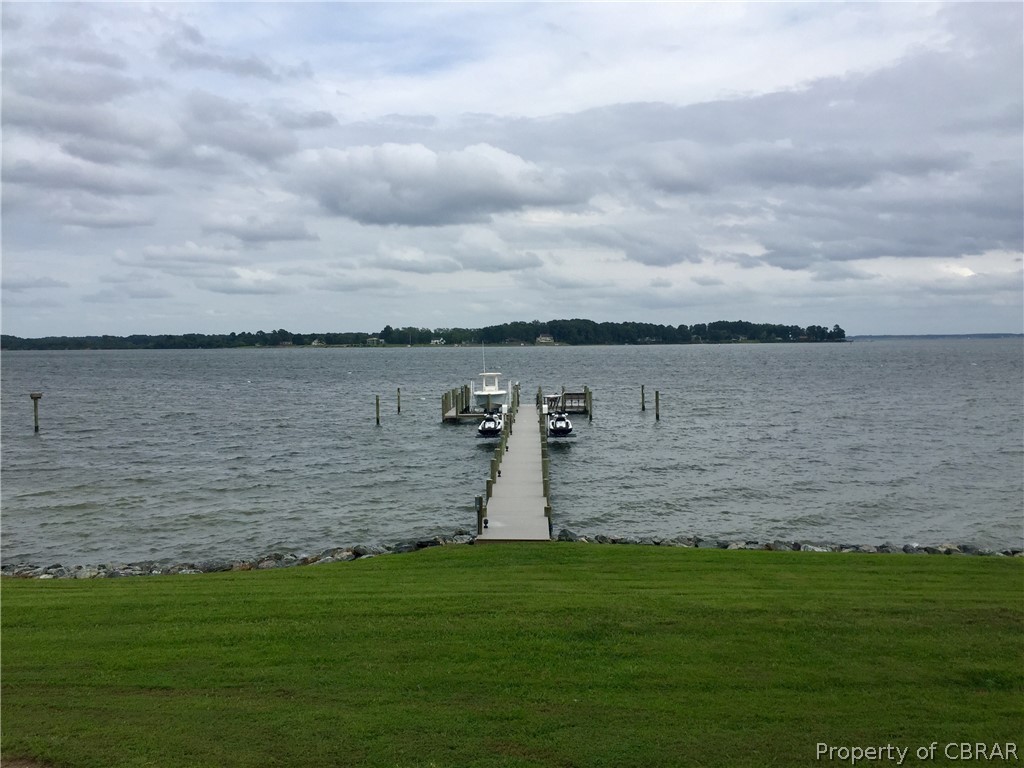 1000 Queenstown Road Lancaster, VA 22503 - Photo 25 of 49 a view of a lake with a beach