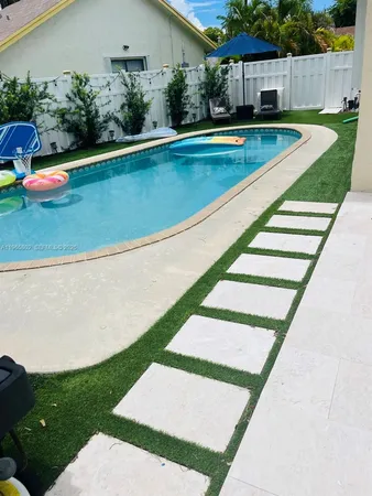 an aerial view of a swimming pool