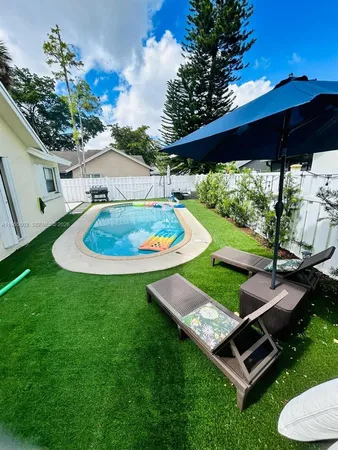 a view of a backyard with a patio
