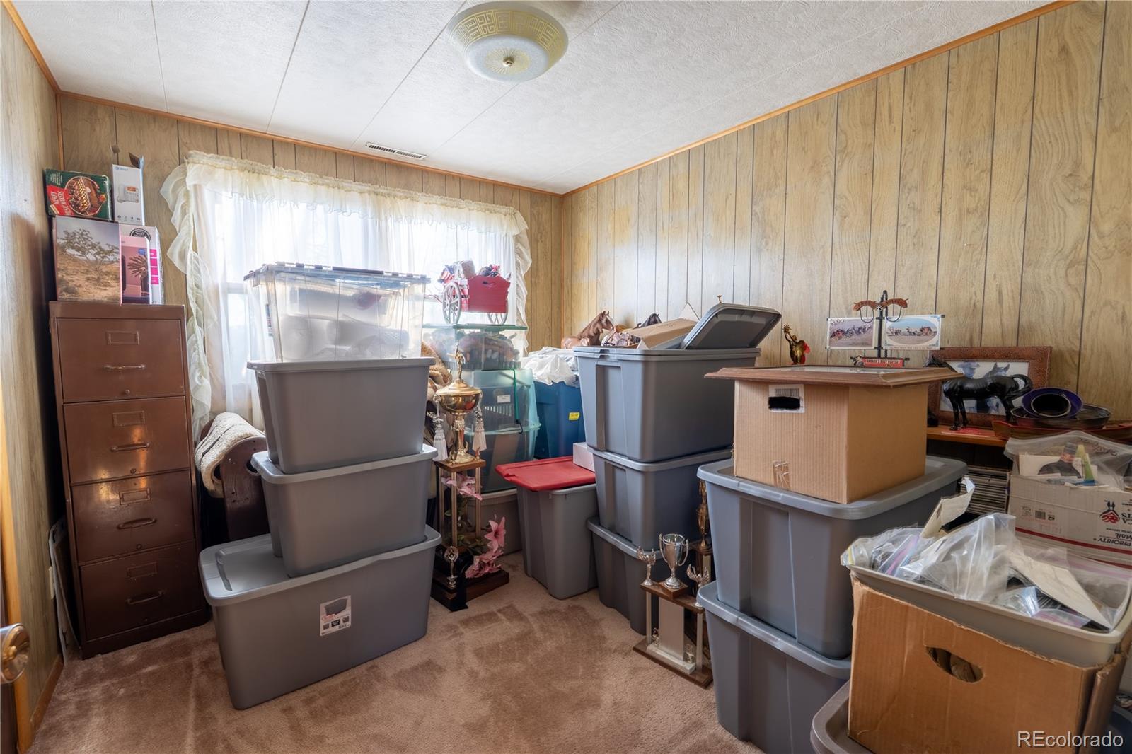 12169 East Baseline Road Lafayette, CO 80026 - Photo 21 of 39 a work room with furniture and a window