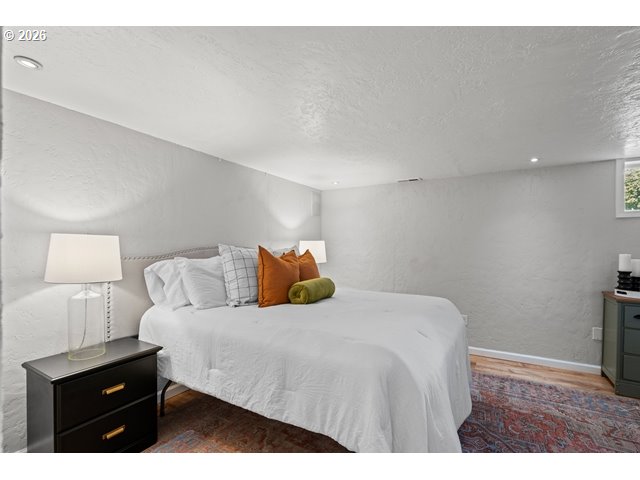 561 East Ridgeway Avenue Hermiston, OR 97838 - Photo 12 of 46 a bedroom with a bed and a night stand